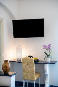TV a/nebo společenská místnost v ubytování Hotel Reginella