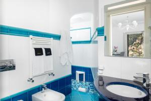 Koupelna v ubytování Hotel Reginella