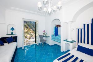 Postel nebo postele na pokoji v ubytování Hotel Reginella