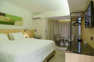 
Cama ou camas em um quarto em Rafain Palace Hotel & Convention Center
