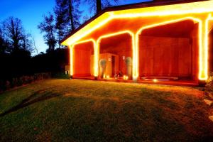 a house with lights on the front of it at Tremezzo Residence in Tremezzo