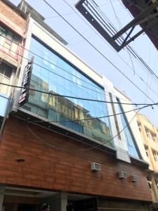 a building with a sign on the side of it at Hotel Reva Regency in Bhopal