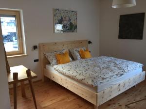 A bed or beds in a room at Cësa Gredine