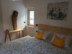 A bed or beds in a room at Cësa Gredine