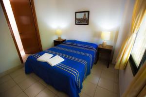Cama o camas de una habitación en Hostal La Parroquia en Comala
