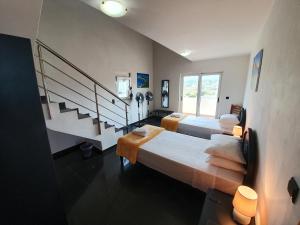A bed or beds in a room at Argo Villa Kalives Még 36 kép