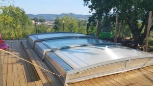 a large trampoline on a wooden deck at Le gite@perché in Sainte-Marguerite