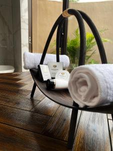 a round table with a towel and a towel at Lira Boutique Lodge in Thohoyandou