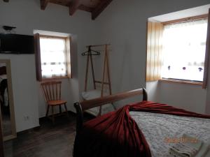 מיטה או מיטות בחדר ב-Adega Jaquet