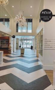 a lobby of a store with a checkered floor at Kompose Boutique Hotel Sarasota in Sarasota +53 photos
