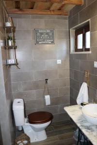 a bathroom with a toilet and a sink at Palheiro do Malgas in Lousã +37 photos