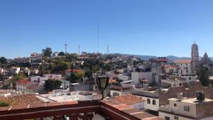 a view of a city with buildings at Luna in Taxco de Alarcón