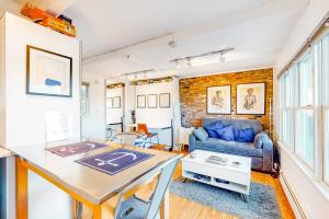 a living room with a couch and a table at A Room With A View in Provincetown