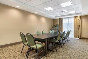 a conference room with a table and chairs at Comfort Suites Medical Center near Six Flags in San Antonio +49 photos