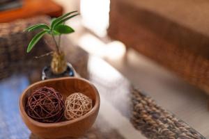 a small plant in a small wooden bowl on a table at LANDMARK NAMBA TSUTENKAKU in Osaka