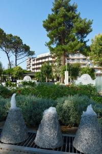 a garden with three large rocks in a park at Democritus in Komotini