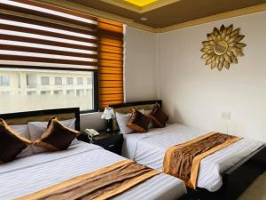 Ліжко або ліжка в номері THẢO AN HOTEL Huế