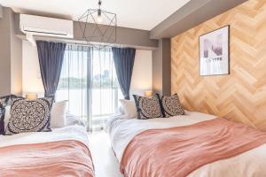 Кровать или кровати в номере Bijou Suites Bloom