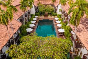 an overhead view of a swimming pool between two buildings at Anantara Angkor Resort in Siem Reap