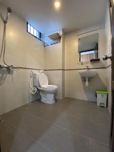 a bathroom with a toilet and a sink at Jasmine Mini Hotel in Hue