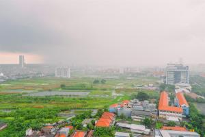 an aerial view of a city with buildings at Classic Studio Room Apartment at Taman Melati Surabaya By Travelio in Surabaya