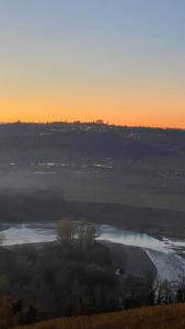 a view of a river at sunset at Casa Boffa in Barbaresco