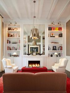 a living room with a couch and a fireplace at Cayena-Caracas in Caracas