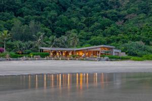 a house on the beach near the water at Six Senses Con Dao - Turtle Island Paradise in Con Dao
