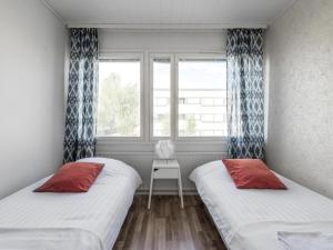 Postelja oz. postelje v sobi nastanitve Kotimaailma Apartments Joensuu
