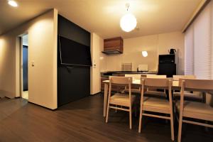 TV a/nebo společenská místnost v ubytování Randor Residence Tokyo Suites
