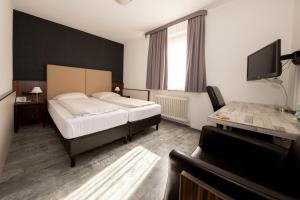 Postel nebo postele na pokoji v ubytování Hotel Krone