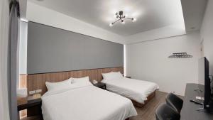 Postel nebo postele na pokoji v ubytování Kimen Yuyu B&B