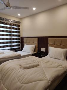 Postel nebo postele na pokoji v ubytování THE GRACE HOUSE Paharganj
