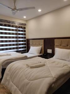 Postel nebo postele na pokoji v ubytování THE GRACE HOUSE Paharganj