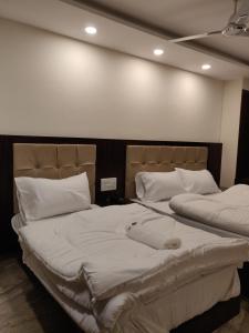 Postel nebo postele na pokoji v ubytování THE GRACE HOUSE Paharganj