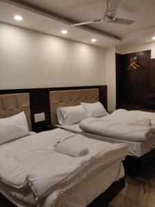 Postel nebo postele na pokoji v ubytování THE GRACE HOUSE Paharganj