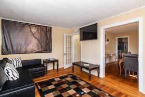 a living room with a couch and a table at 915CountyLineRoad Luxury Mainline Train Colleges in Bryn Mawr