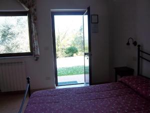 Postel nebo postele na pokoji v ubytování Agriturismo Norianino