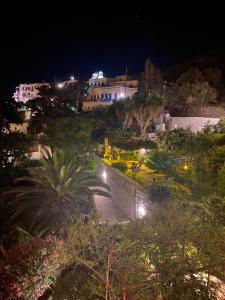 a view of a city at night at Anna Studios in Katapola