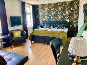 Postel nebo postele na pokoji v ubytování Reenskaug Hotel