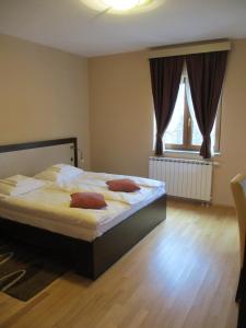 Postel nebo postele na pokoji v ubytování Apartments Manjan