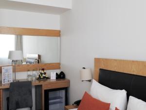 Voodi või voodid majutusasutuse Le Pietri Urban Hotel toas