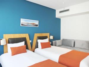 Voodi või voodid majutusasutuse Le Pietri Urban Hotel toas
