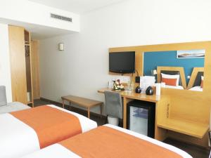 Voodi või voodid majutusasutuse Le Pietri Urban Hotel toas