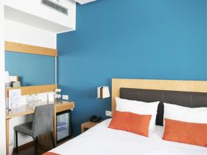 Voodi või voodid majutusasutuse Le Pietri Urban Hotel toas