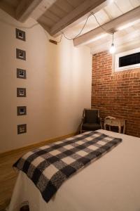 A bed or beds in a room at Acini e Rose