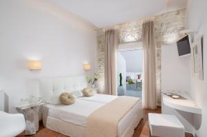 Letto o letti in una camera di Adriani Hotel