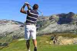 a man standing on top of a golf course at GREEN APPLE CARROZ Duplex WIFI Garage Balcon-Sud Vue Montagne in Les Carroz d'Araches +10 photos