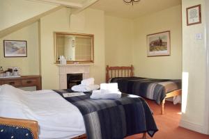 מיטה או מיטות בחדר ב-Bewdley Hill House