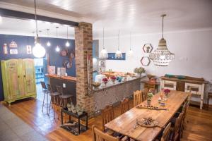 a dining room and kitchen with a table and chairs at Melrose Place Guestrooms in Potchefstroom